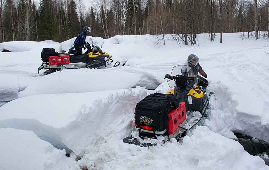 Evgeniy Borodin gets his snowmobile stuck.