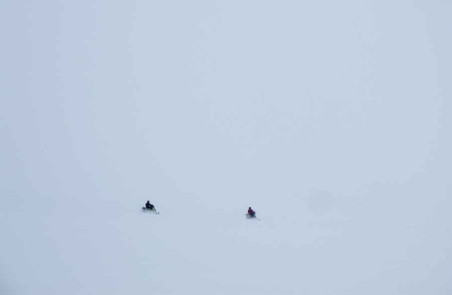 Snowmobiling in fog of Oslyanka Mountain