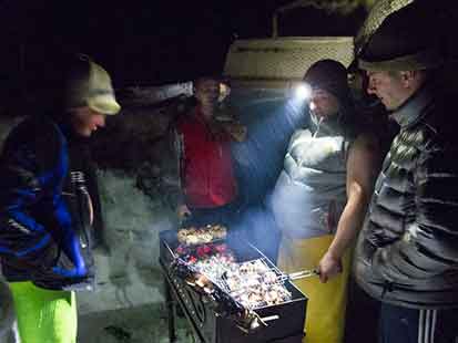 Russian banya BBQ during snowmobile adventure