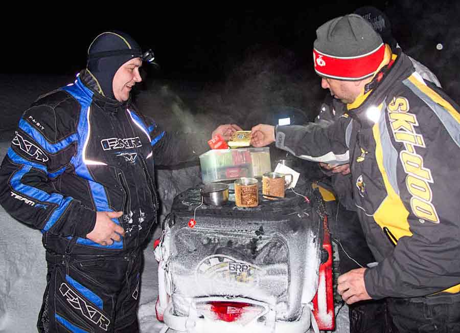 Tea time during snowmobile adventure in Russia.