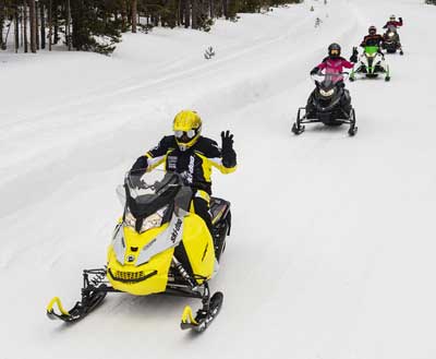 Snowmobile Hand Signals hands on the bars for safety