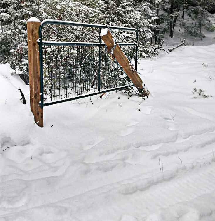 Closed gate snowmobile trail