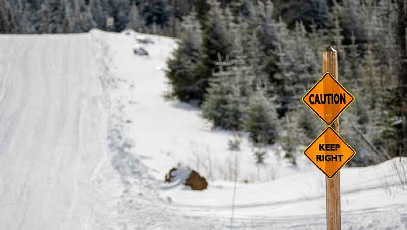 Snowmobile trail signs stay right