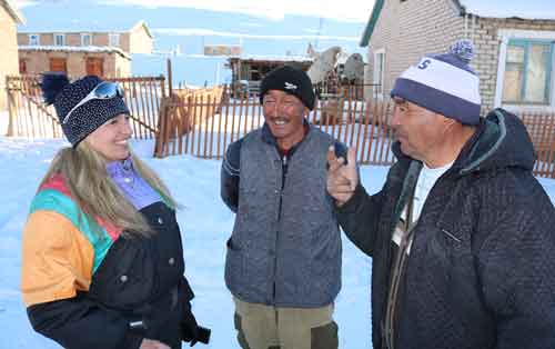 Female snowmobilers meet residents of Archaly Village Tian-Shan Mountains, Kyrgyzstan