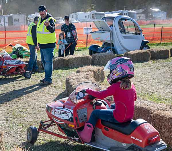 Volunteer assisting with the snowmobile events at the NH grass drags.
