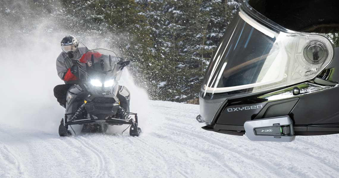 Cardo Packtalk Bold on helmet while snowmobiling