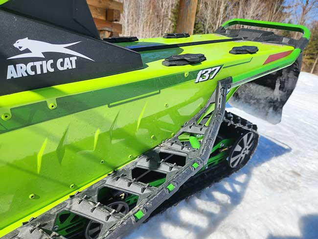 Arctic Cat Catalyst ATACH system on green snowmobile